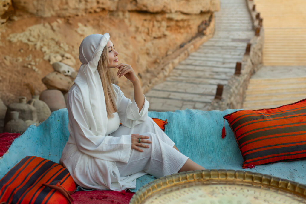 morocco-man-with-backpack-sitting-on-desert-dunemorocco-experts-travel-tourism